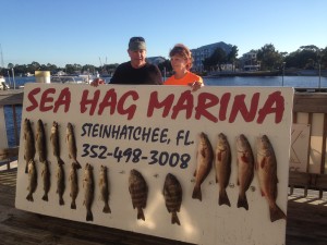Bill and Sheila Rees with a mixed board of redfish, trout and sheepshead caught in a creek on jigs tipped with Gulp lures.