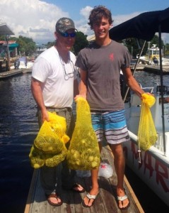 Mike Lumley from Tennessee and his grandson, Alex  Blaquiere with several scallop limits taken on a Sea Hag rental boat. 