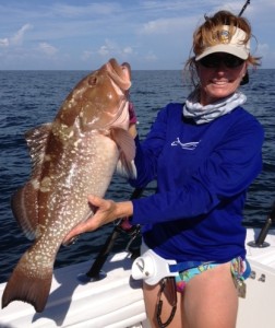 Capt. Leiza Fitzgerald with a fine red grouper. 