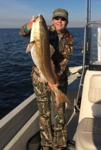 Tracy Settees and her largest fish to date, another bull redfish. 