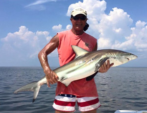 Tim Colwell from Blairsville, Georgia with a hefty bull shark. 