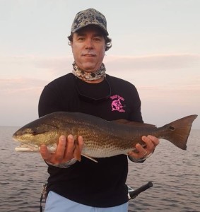 Chandler Altman (also known as Manny’s husband) was wearing his Tailin’ Toads when he caught this excellent upper slot redfish. 