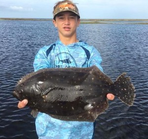 Chase Norwood with a huge flounder. 