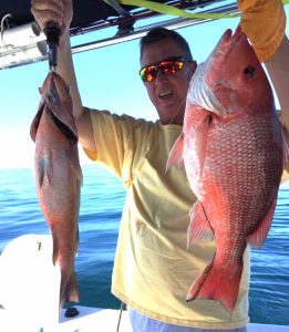 Derek Simpson from Macon with a fine pair of snapper. Unfortunately one of them had to go back in the water. 