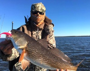 That’s Luke Matthews all bundled up with a redfish that also fell for a soft jerkbait.