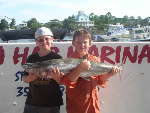 Walker Kelly needed help from Noah Plemons to hold his kingfish. 
