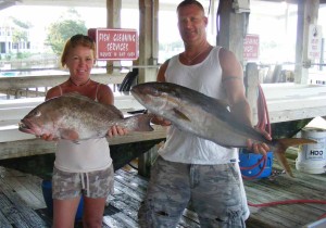Teresa Mixon and Brad Parrish from Jacksonville with just some of their mixed offshore bag of gag and red grouper, amberjack and Florida snapper