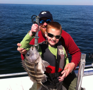 Luke Holloway with his first sheepshead and proud dad, Mark