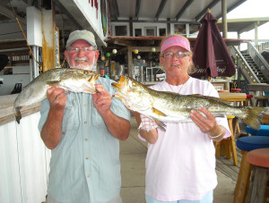 Old friends Jeff and Debbie Evans with some fine trout caught during the Optimist Club tournament. 