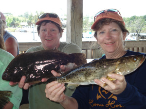 Capt. Nita Chester and twin sister Marie Griffies with a fine flounder/trout duo. 