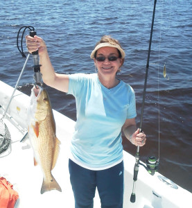 Trish Leary with a fine redfish caught on the traditional bait…..a gold spoon.