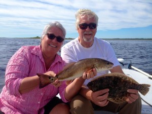 Lark Hayes from Chapel Hill, NC and Tom John from Nashville, TN with a fine redfish and flounder.