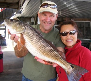 Jeff Steele and Lily Johnson from Jacksonville with one of several nice redfish they caught. 