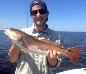 Fishing with me, Eliot Barth caught his first redfish!