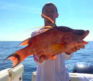 Sea Hag’s Derek Snyder with a hog snapper taken on a spearfishing trip.
