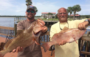 Jason Vinson and Terry Alexander with a pair of fine red grouper. 