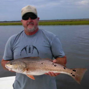 Keith Cooper and a fine redfish with lotsa spots. 