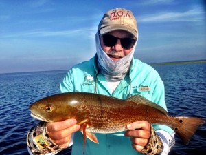 Capt. Tommy Thompson with one of five redfish we caught on an early morning trip. 