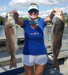 Kristin Griffis with a pair of tournament-sized redfish. 