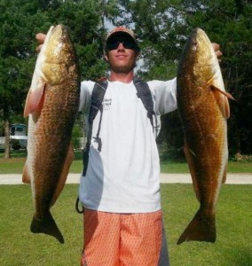 Gage Griffis with a beautiful pair of upperslot redfish. 