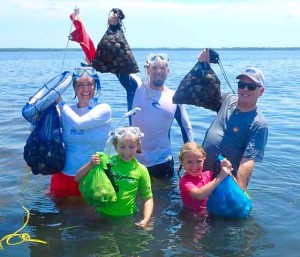  The Riddle family hit the water on opening day and filled their bags with scallops. 