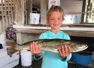 Little Addie knows where the big trout are, and it’s a secret. 